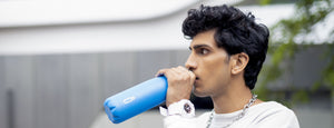 Man Drinking Water from Unbottle Reusable Bottle